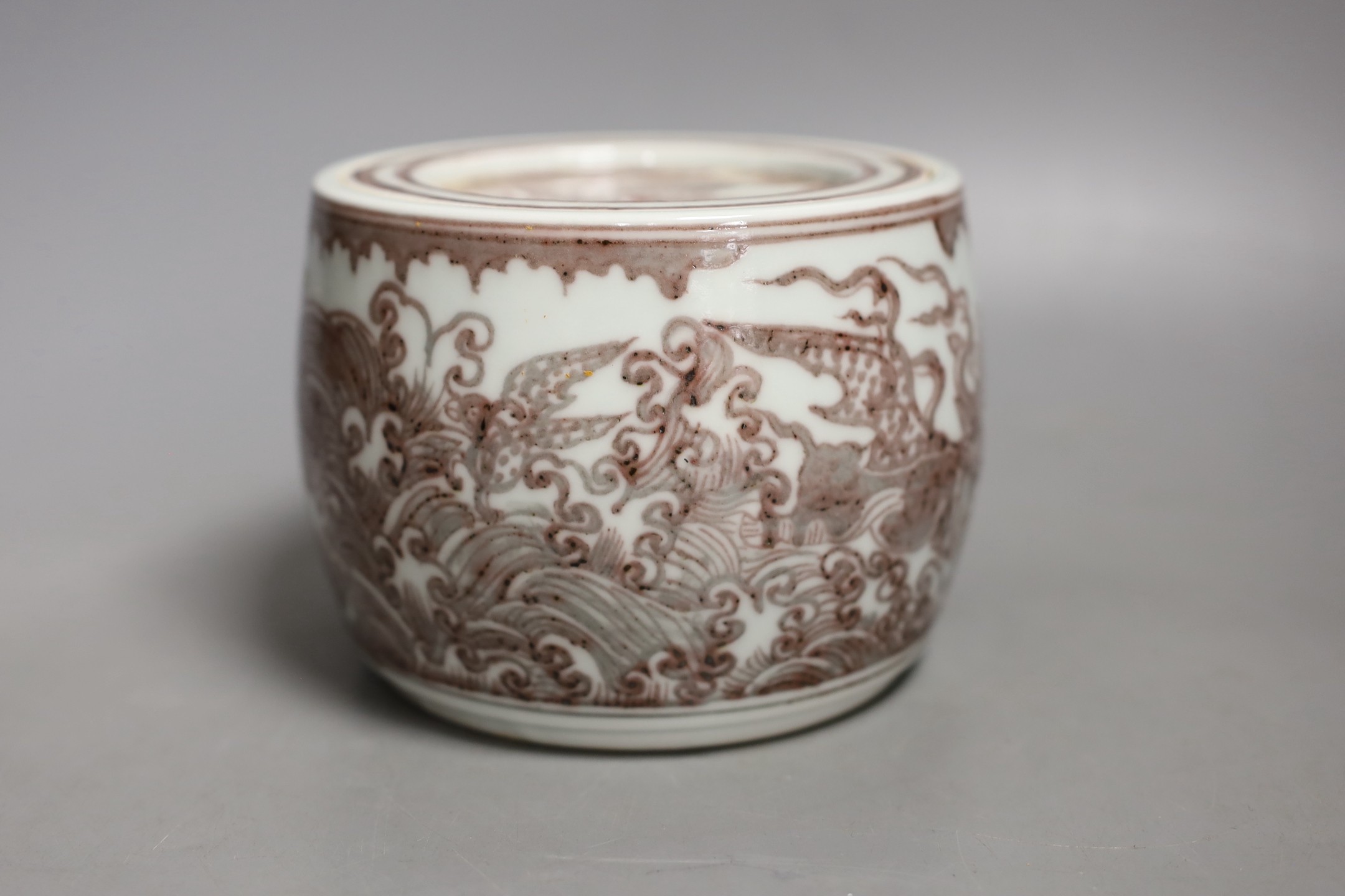 A Chinese iron-red underglaze jar and cover-10 cms high.